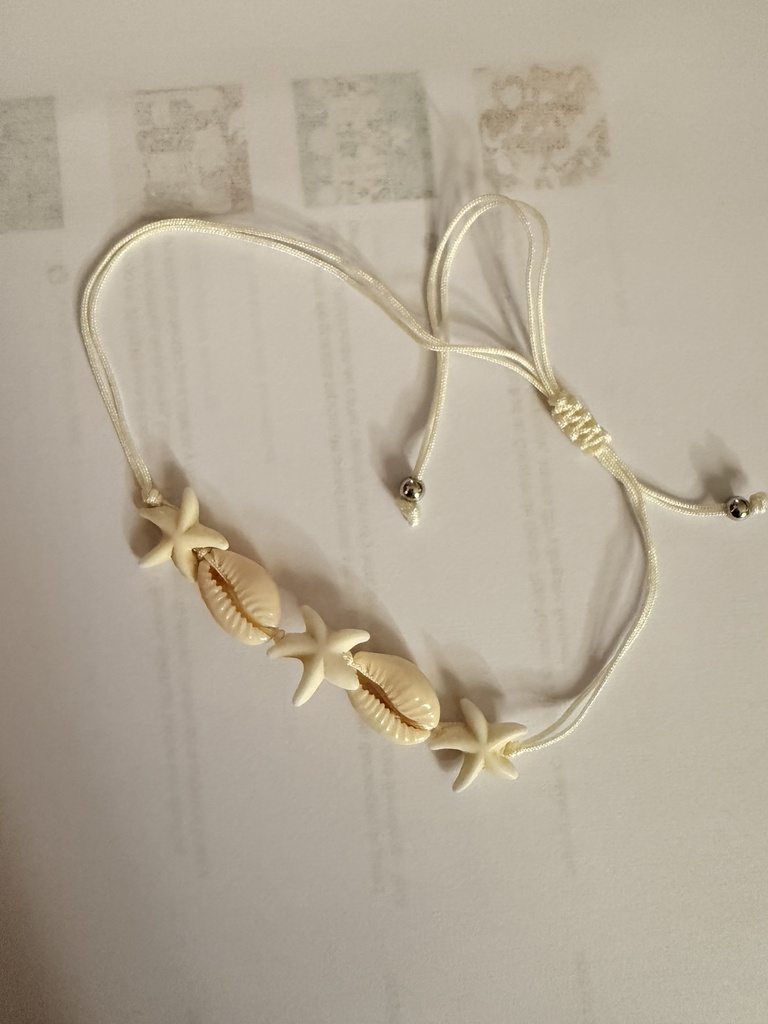 Pulsera estrella y concha blanca